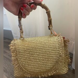 Cult Gaia Ozzy Mini Top Handle bag in gold.